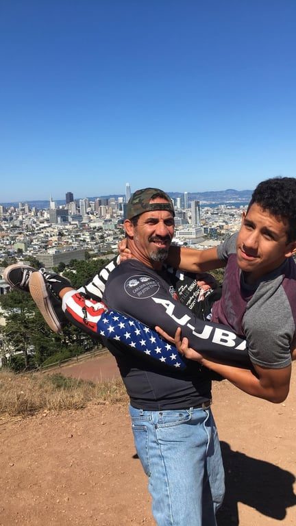 Mad Dog Elite BJJ members with a US-flag gi outdoors