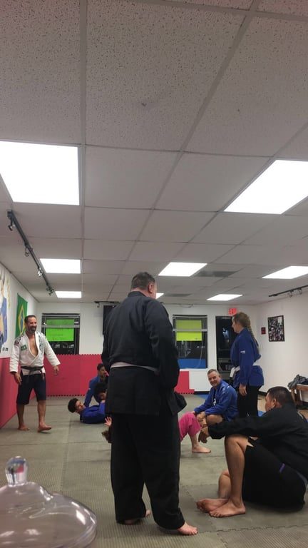 Instruction on the mat at Mad Dog Elite BJJ