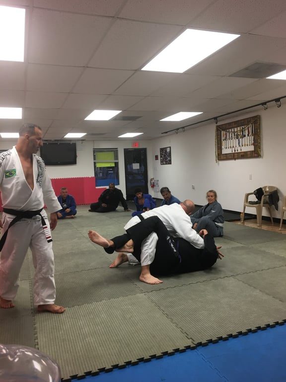 Instructor demonstrating a technique at Mad Dog Elite